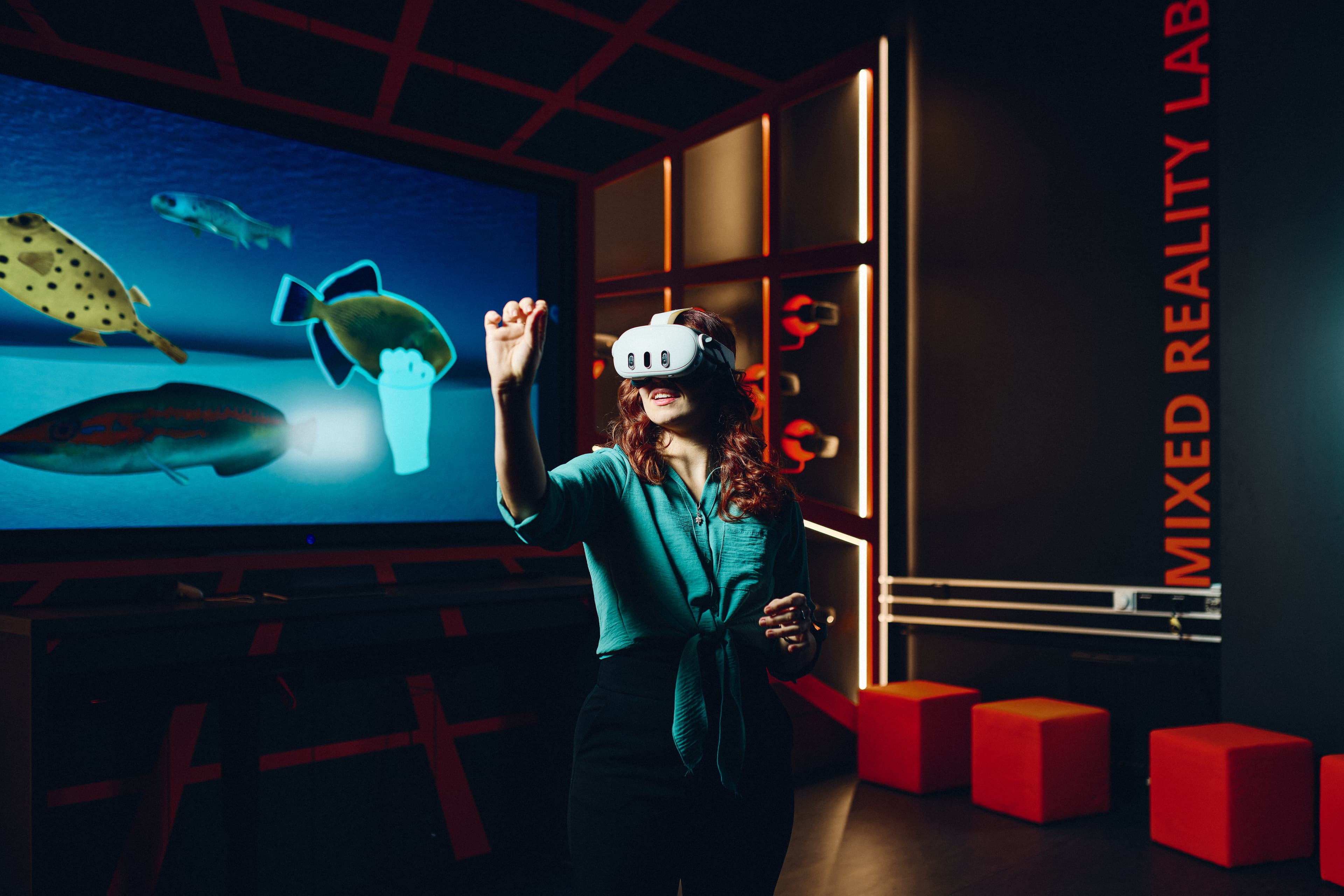 A person with VR glasses using the Mixed Reality Lab